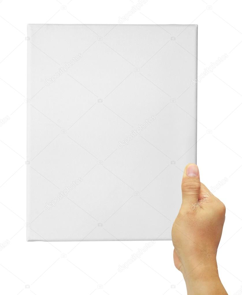 Hand holding up a white blank canvas isolated on white backgroun