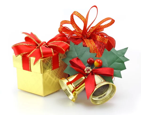 Gift boxes and gold bell — Stock Photo, Image