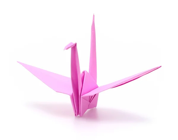 Růžový origami pták na bílém pozadí — Stock fotografie