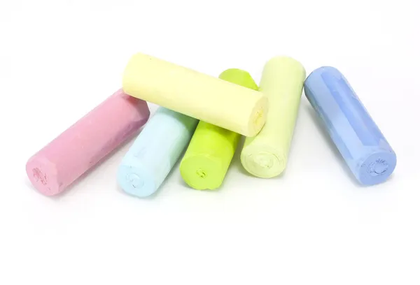 Chalks in a variety of colors on a white background — Stock Photo, Image