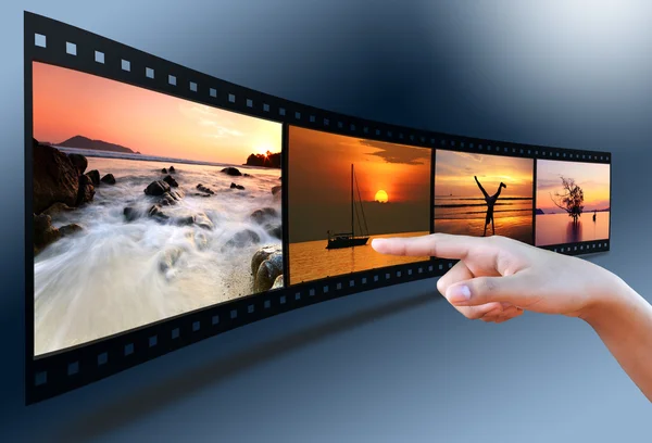 Hand pointing image in 3D film strip — Stock Photo, Image
