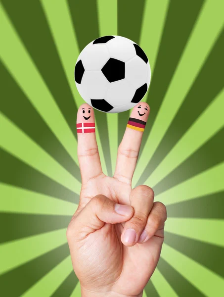Victoria de mână cu conceptul de minge de fotbal Danemarca VS Germania — Fotografie, imagine de stoc