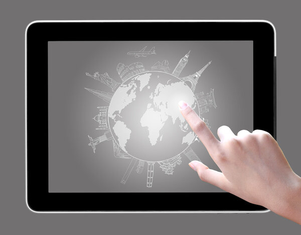 Hand touch on tablet pc to drawing travel around the world