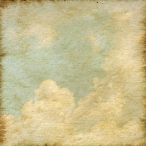 Antiguo fondo de textura de papel morera con una nube y cielo azul — Foto de Stock