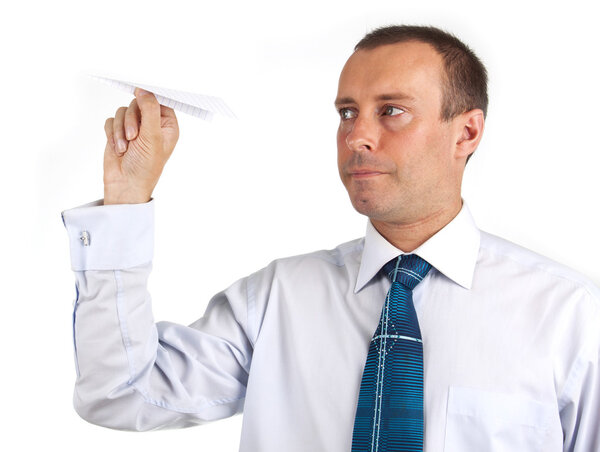 businessman throwing a paper airplane