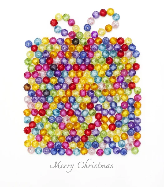 Gift box made of colorful beads on white background — Stock Photo, Image