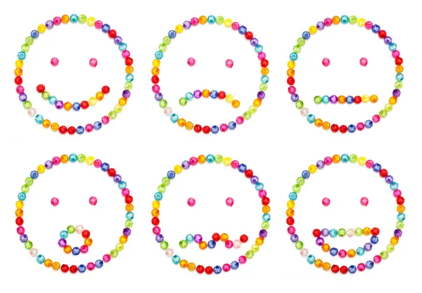 A set of very original emoticon decorate by colorful beads on w — Stock Photo, Image