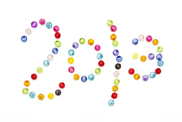 Boldog új évet 2013 díszíteni fehér háttérb színes gyöngyök — Stock Fotó