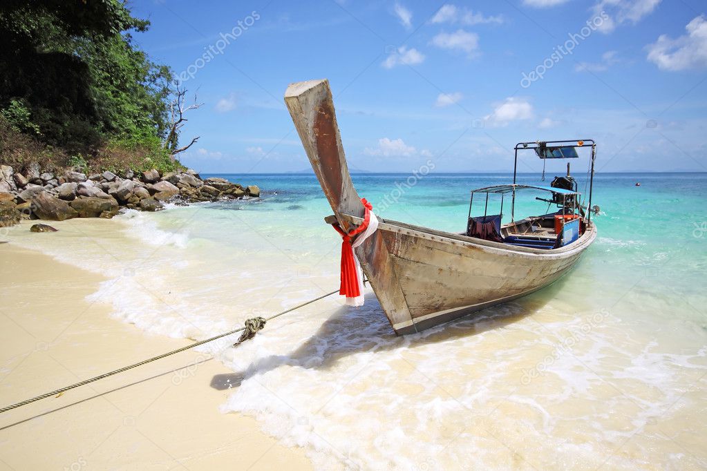 Tropical beach with thai longtail boat, Andaman Sea, Thailand