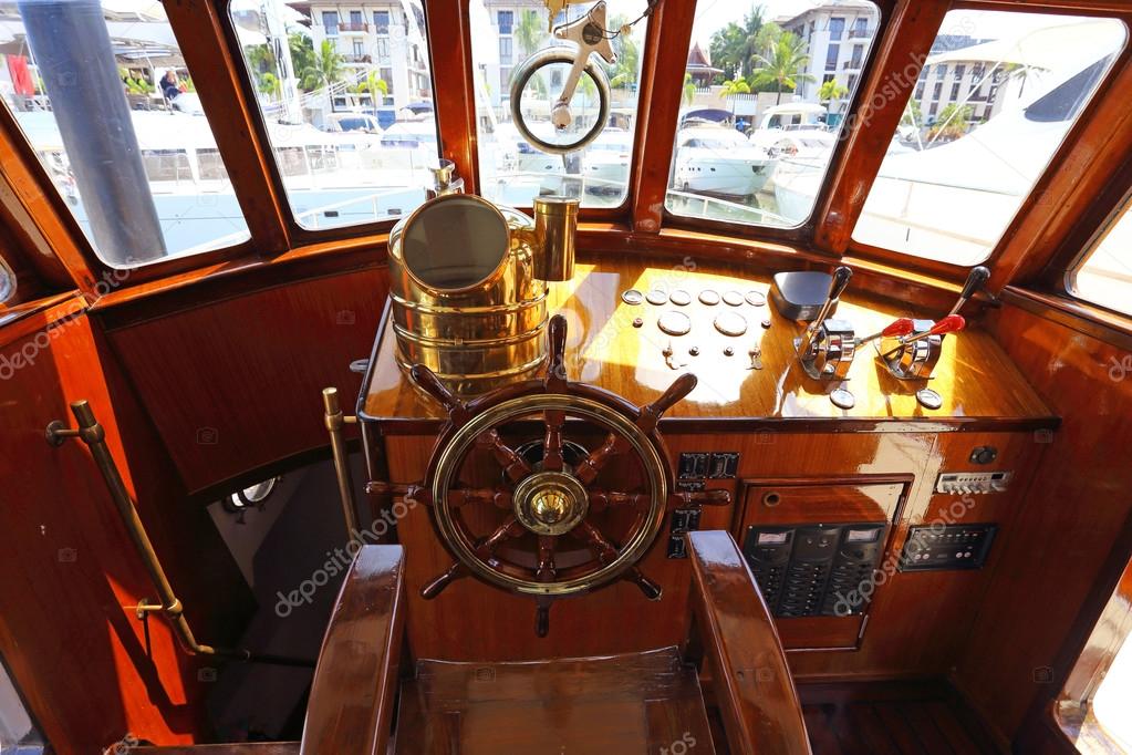 steering wheel on a luxury yacht cabin.