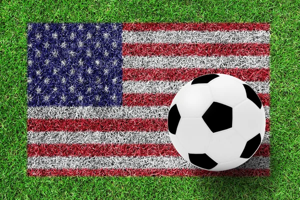 Soccer ball on flag of American as painting on green grass backg — Stockfoto