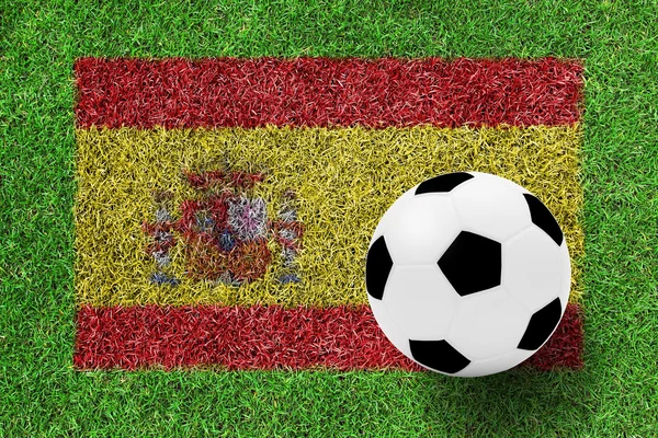 Soccer ball on Flag Spain as a painting on green grass — Stock Photo, Image