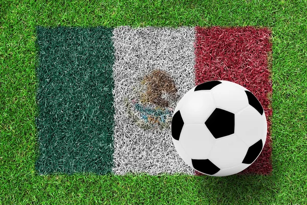 Футбольный мяч на флаге Мексики как картина на зеленой траве — стоковое фото