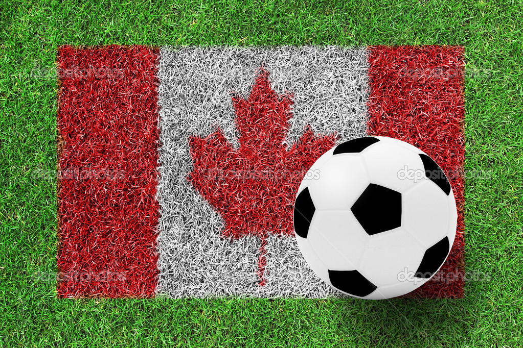 Soccer ball on Canada flag as a painting on green grass — Stock Photo