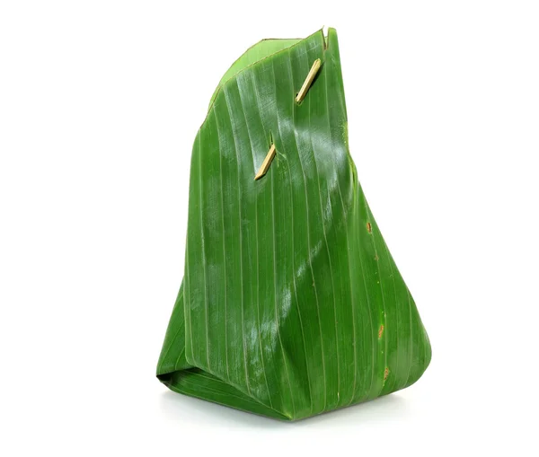 Thai dessert wrapped in banana leaves. — Stock Photo, Image