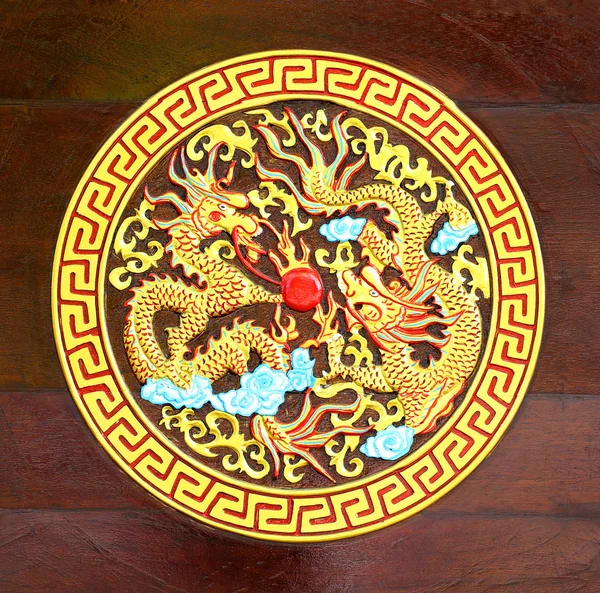 Golden Dragon carved wood background — Stock Photo, Image