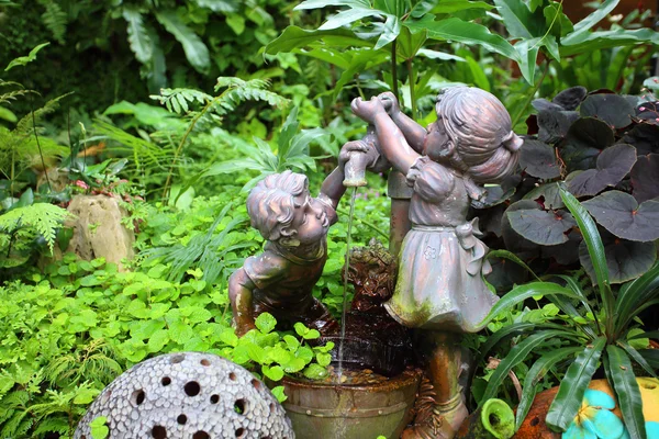 Vintage water pump in the garden — Stock Photo, Image