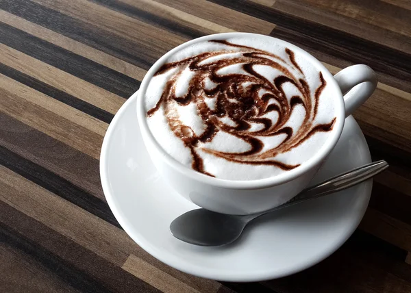 Cup of coffee latte on a wood table — Stock Photo, Image