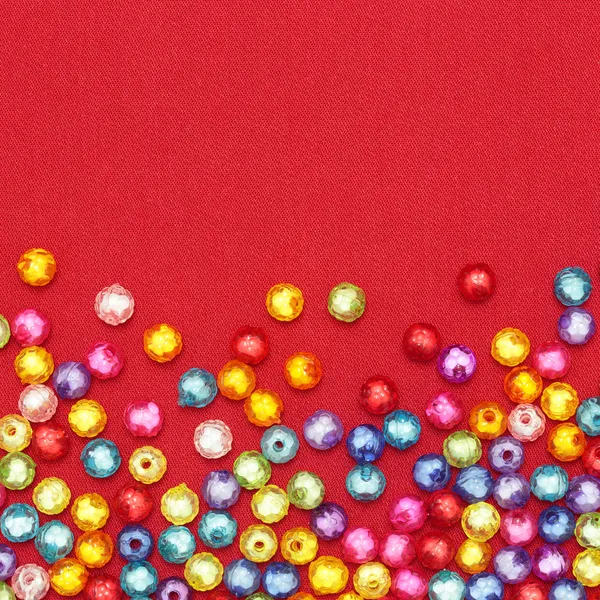 Abstract Colorful beads on red background — Stock Photo, Image