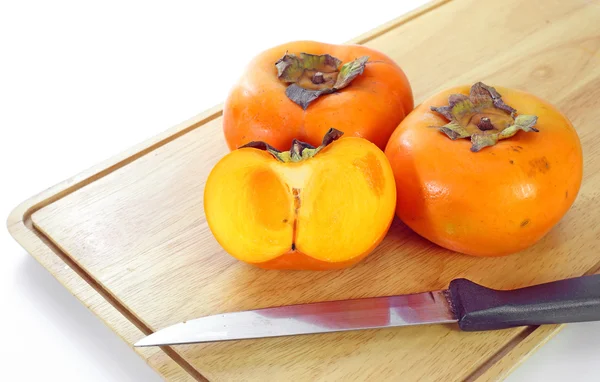 Persimmon mûr frais sur un bois — Photo