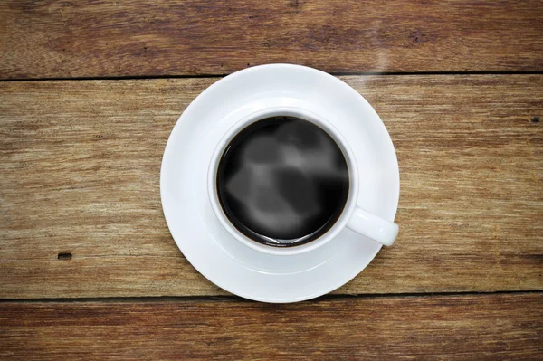 Cup of coffee on wood background — Stock Photo, Image