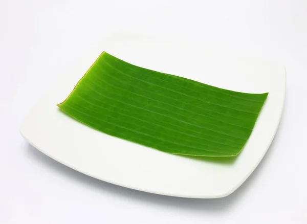 Banana leaf på blank nummerplåt redigera mat eller ämne på — Stockfoto