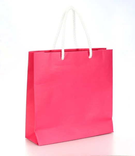Roze winkelen papieren zak geïsoleerd op een witte achtergrond — Stockfoto