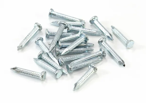 Heap of silver concrete nails texture on white — Stock Photo, Image