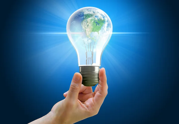 Hand holding light bulb globe — Stock Photo, Image