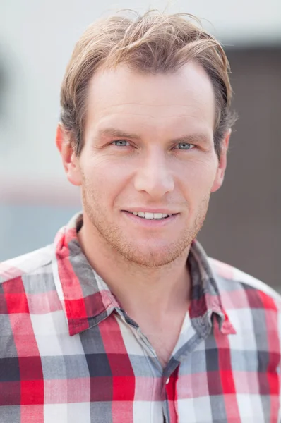 Man in checkered shirt — Stock Photo, Image