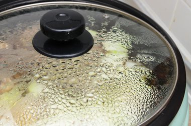 The steam on pot lid. When cooking the soup clipart