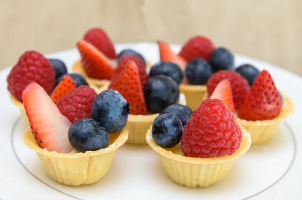 Fruit Tart with berries on white disc — Stock Photo, Image