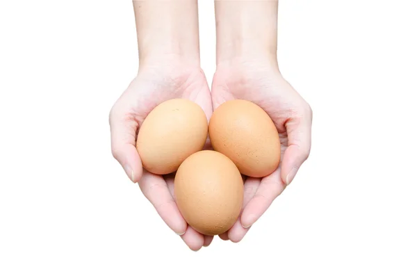 Drie eieren in vrouwen handen — Stockfoto