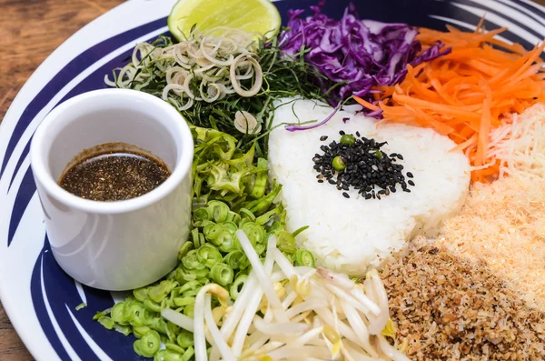 Nasi kerabu - Rice with herbs and vegetables Stock Photo