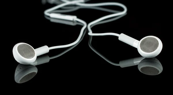 Portable white earphones — Stock Photo, Image