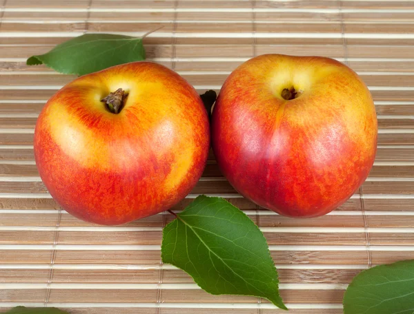 Two bright ripe juicy nectarine — Stock Photo, Image