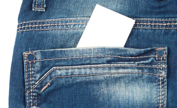 Back pocket of blue jeans with a white card Royalty Free Stock Photos