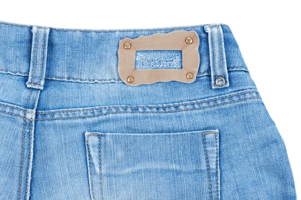 Rear pocket of blue jeans with leybom — Stock Photo, Image