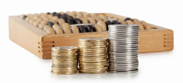 Three columns of coins with bills — Stock Photo, Image