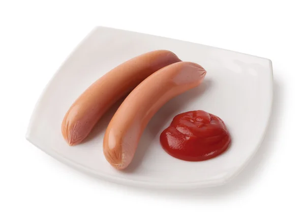 Raw sausages on a plate — Stock Photo, Image