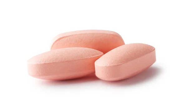 Three pink pills — Stock Photo, Image