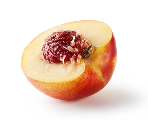 Halv persika med sten — Stockfoto