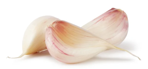 Three cloves of raw garlic — Stock Photo, Image
