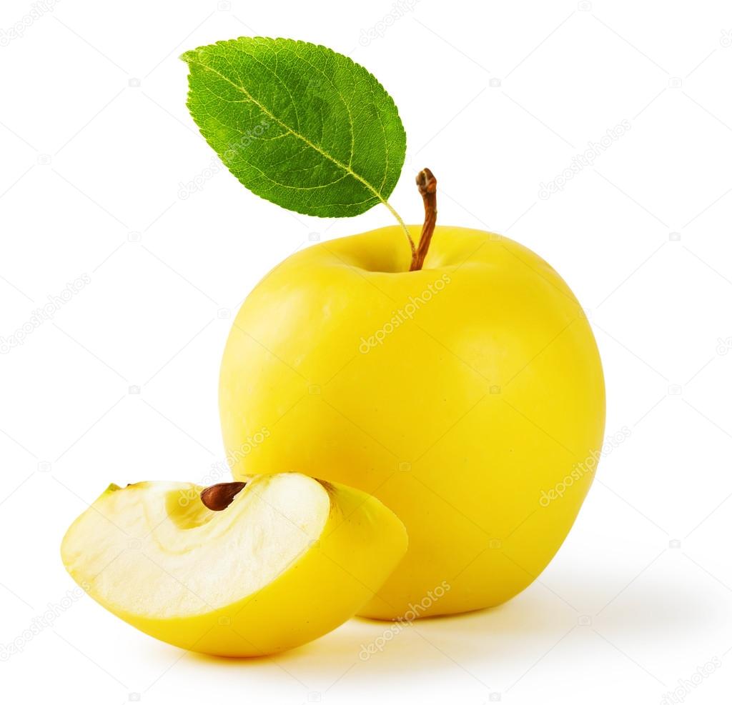 Yellow apple with a slice and leaf