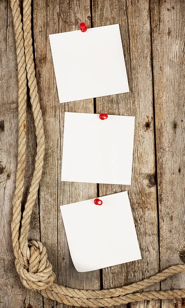 White stickers on wooden background — Stock Photo, Image