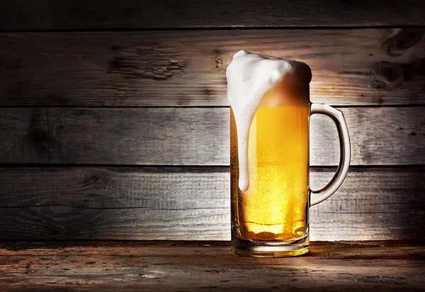 Mug of light beer with foam — Stock Photo, Image