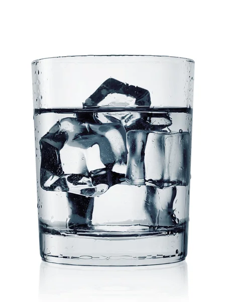 Misted glass of cold water with ice — Stock Photo, Image