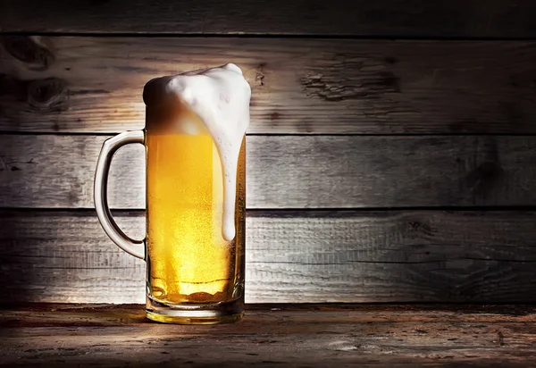 High foamy mug of light beer — Stock Photo, Image