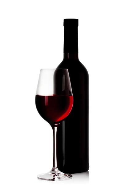 Şişe ve bir kadeh kırmızı şarap. — Stok fotoğraf