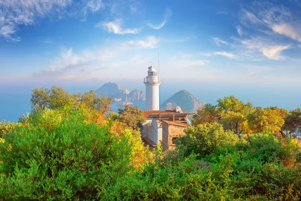 Lighthouse at Cape Gelidonia among green trees — стокове фото